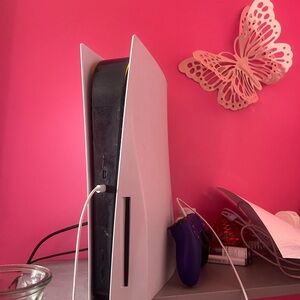 I am selling a PlayStation and a purple controller and they are both cleaned